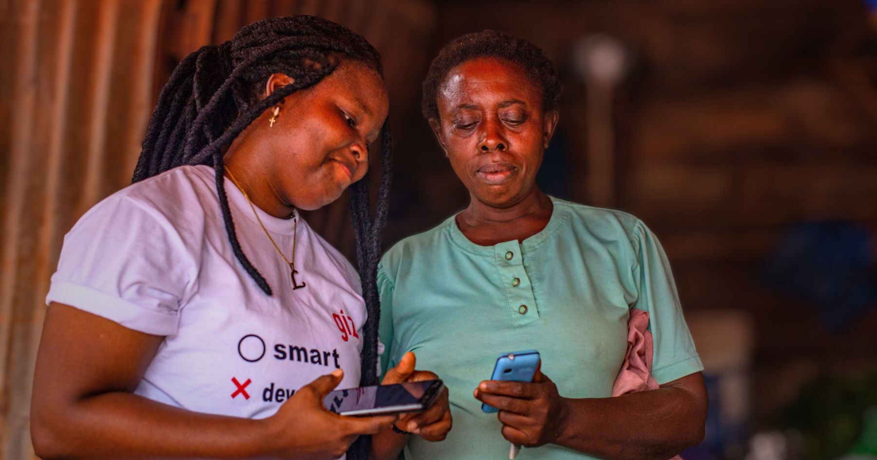 An employee of our partner organisation GLRA Nigeria installs Audiopedia on a feature phone using an SD card.